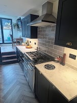Luxury House | Private kitchen | Full-size fridge, microwave, oven, stovetop