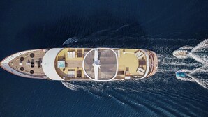 An aerial view of a yacht with a sun deck, a swimming area, and a dining area. - Sun-Kissed Sailing Adventure in Split, Croatia (Split)