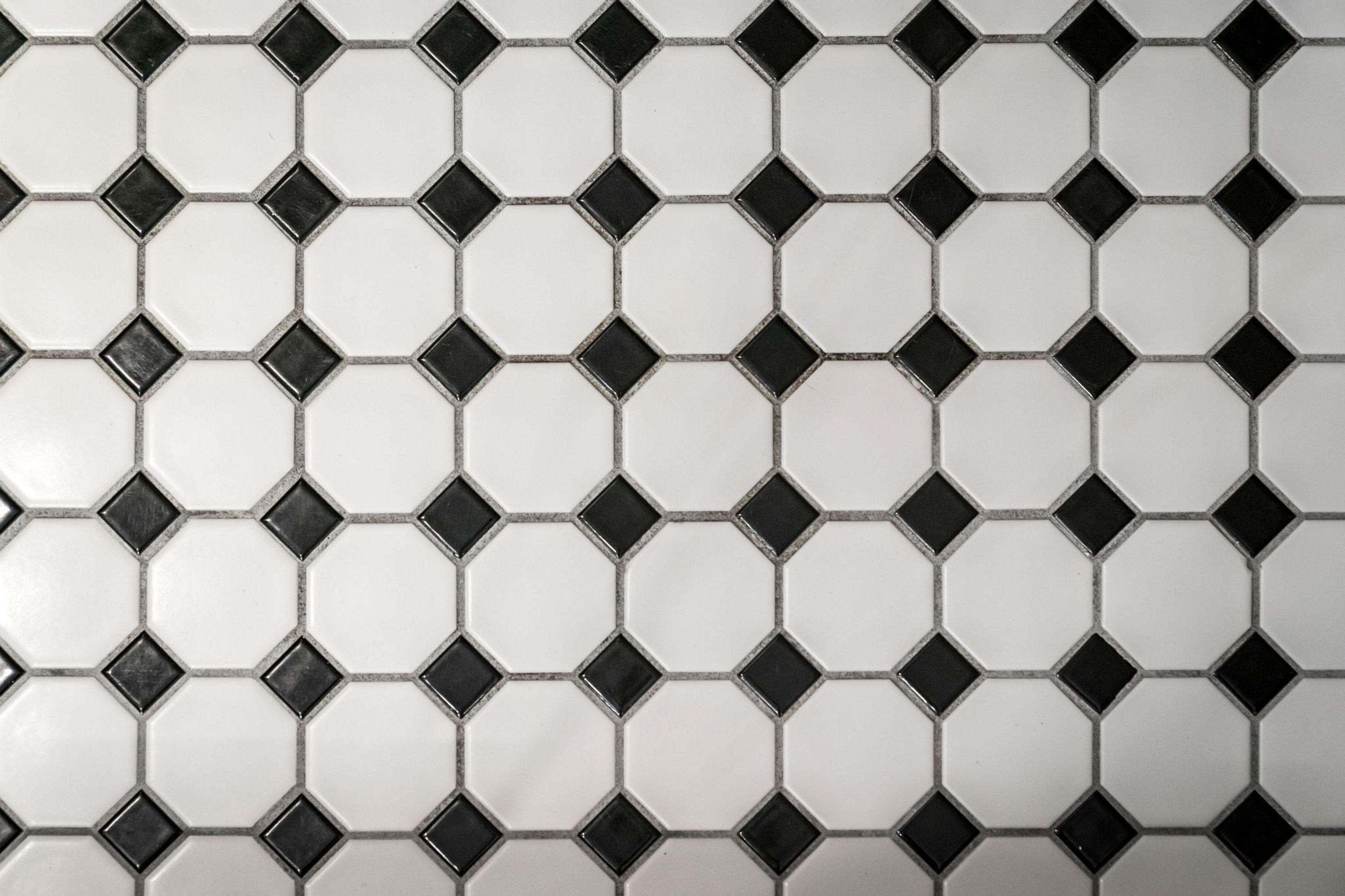 A pattern of white and black hexagonal tiles.