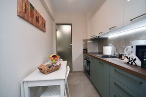 Suite superior, vista al mar | Cocina privada