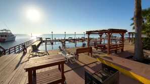 Apartment, 2 Bedrooms | Outdoor dining - Direct Bayfront Sunsets - Boat Docks - Pool - Fish 2 Bedroom Apts (South Padre Island)