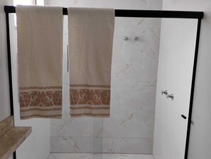 Shower, towels, toilet paper