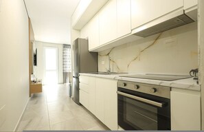 Private kitchen - SanPietro Vacation Apartment 024 (Plazhi San Pietro)