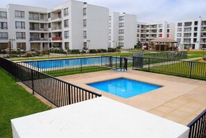 Pool - Centrally located condominium with swimming pool, barbecue area and children's playground. (La Serena)