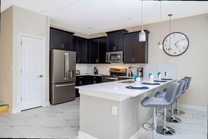 Fridge, microwave, oven, stovetop - Spacious 7BR w  Pool  Spa   Game Room Near Disney (Kissimmee)