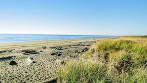 A beach with sand, grass, and a clear sky. - NEW! Pool, BBQ, Beach Access, Hot Tub, Gym (SDreaming) (Westport)