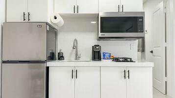 Fridge, microwave, coffee/tea maker, toaster