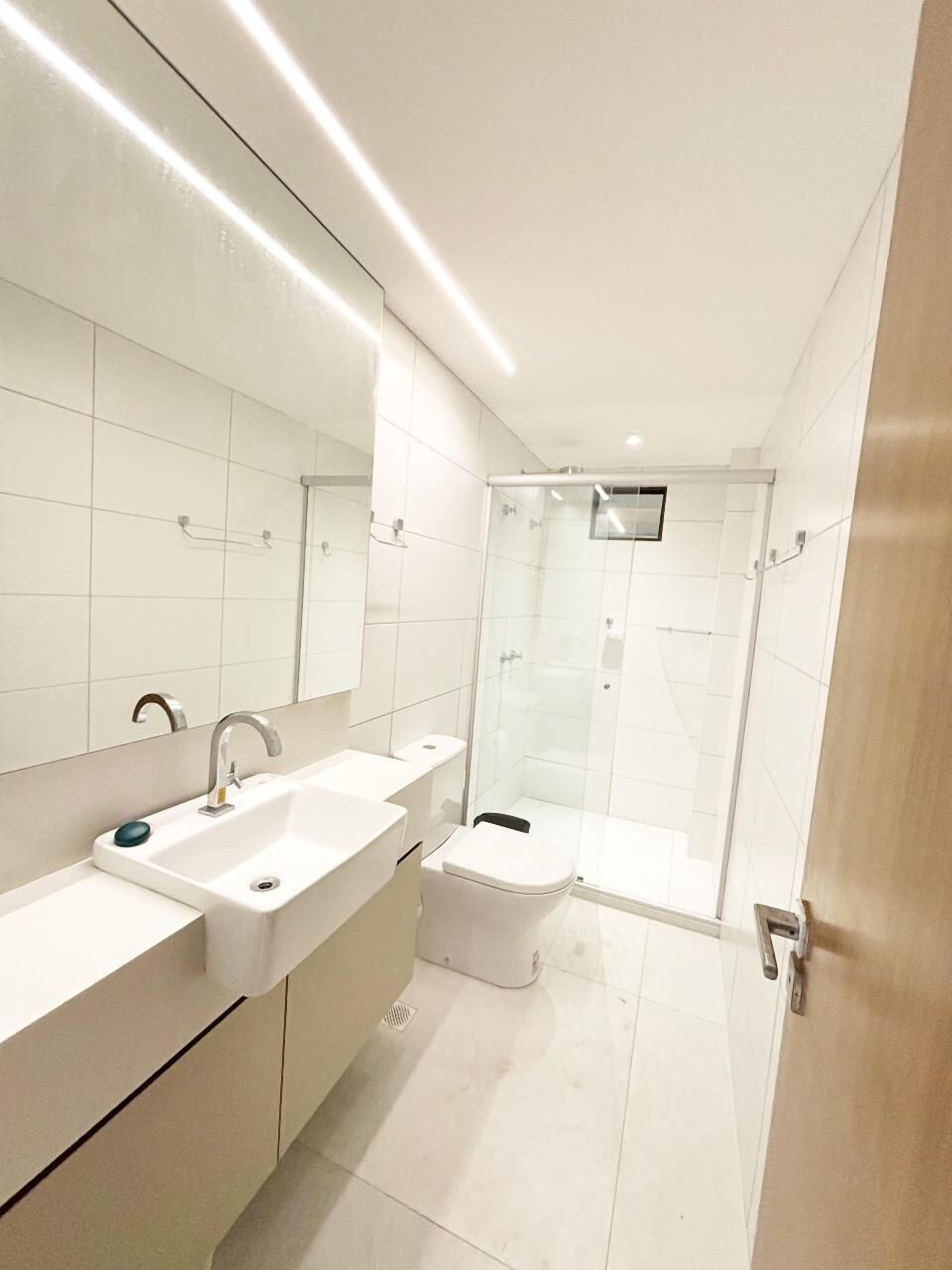 Shower, hair dryer, towels, toilet paper