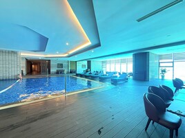 Indoor pool, open 6:00 AM to 5:00 PM, sun loungers, lifeguards on site