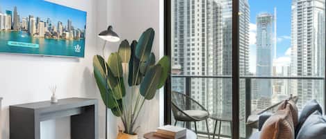 City Apartment, City View | Living area | 50-inch Smart TV with cable channels