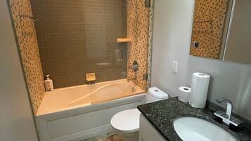 Jetted bath, towels, soap, toilet paper