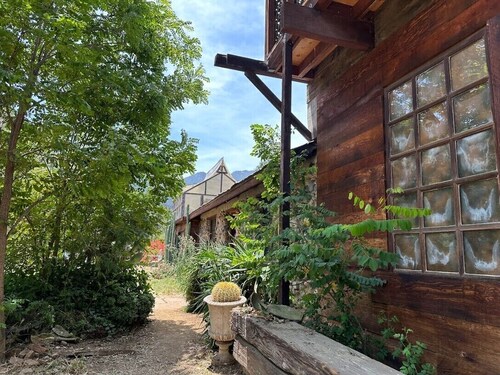 FRENCH 1914 STONE CABIN w/ clawfoot bathtub, fireplace + private trails & creek