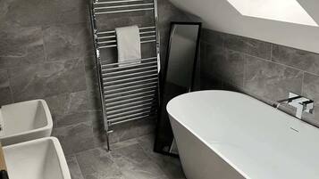 Shower, hair dryer, towels, shampoo