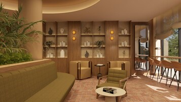 A modern living room with a sofa, chairs, a coffee table, and a bookshelf with decorative items.