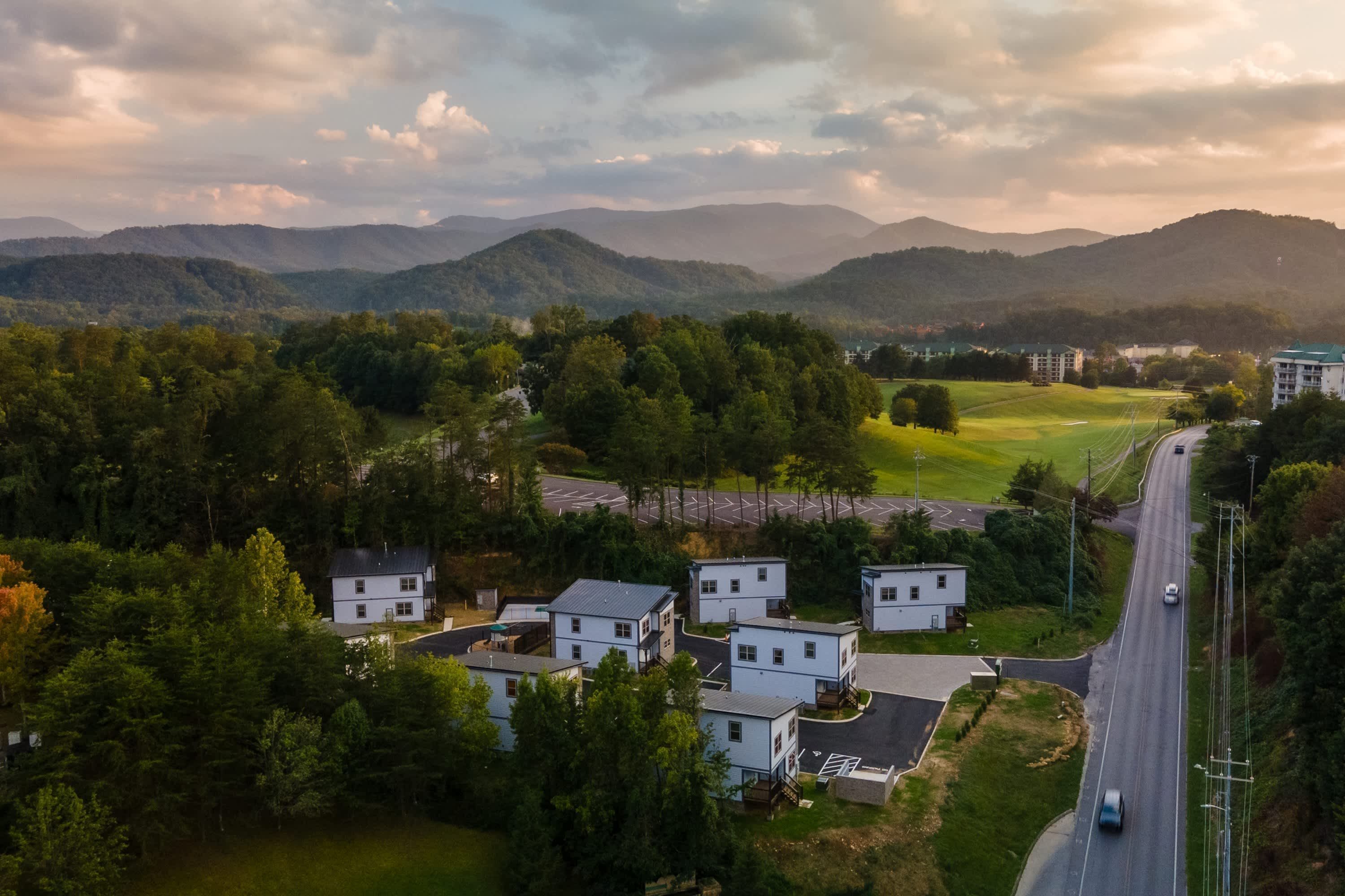 A residential area with houses and a road.