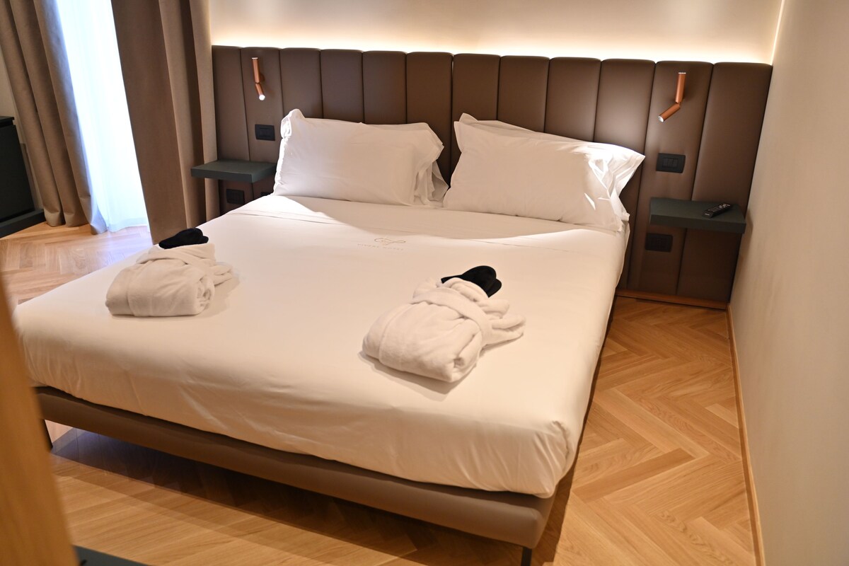 Superior Triple Room, Courtyard View | In-room safe, desk, laptop workspace, blackout drapes