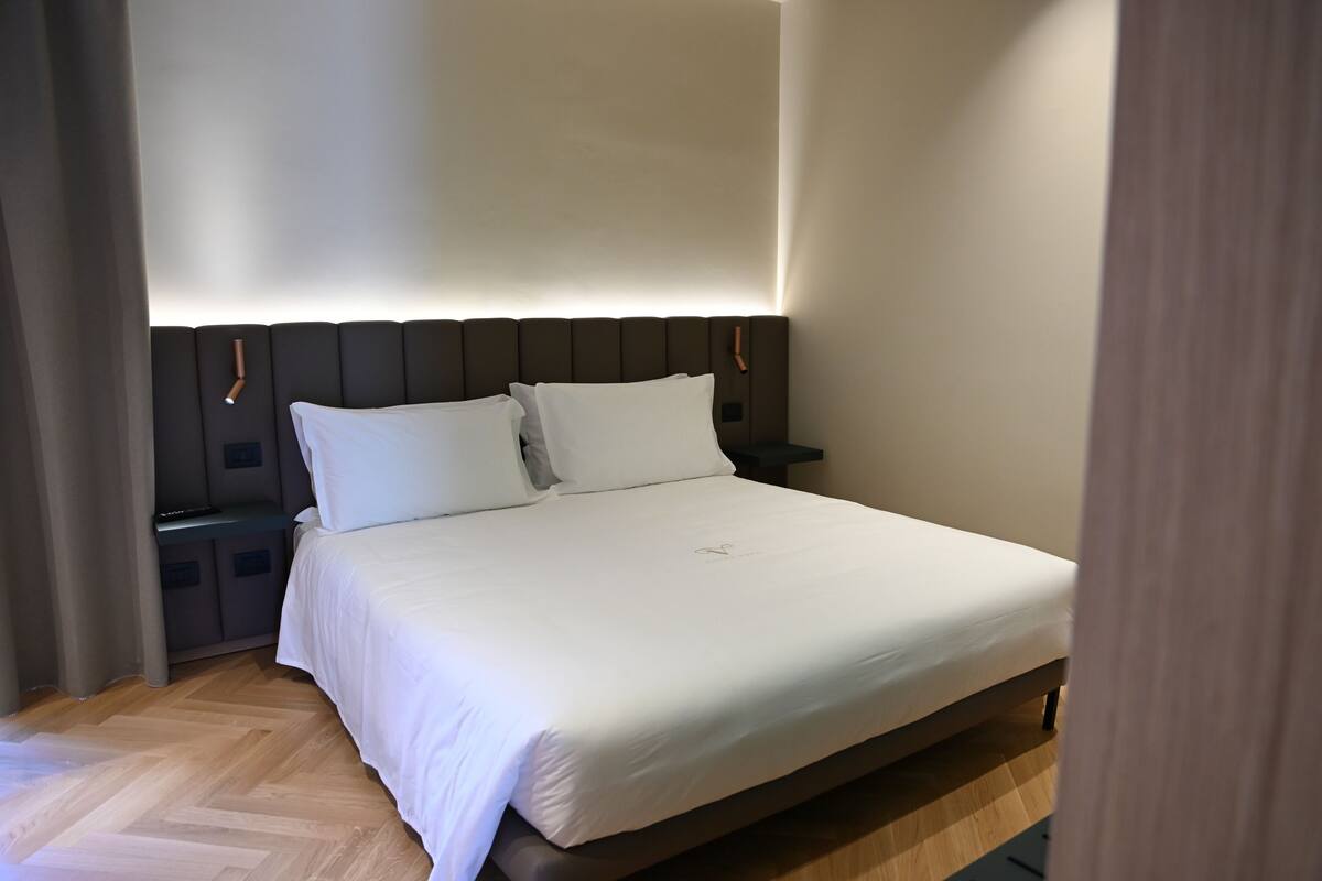 Junior Suite, Balcony, City View | In-room safe, desk, laptop workspace, blackout drapes