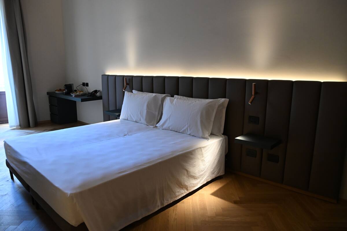 Deluxe Double or Twin Room, Balcony, City View | In-room safe, desk, laptop workspace, blackout drapes