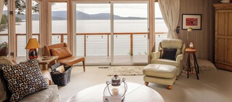 
Watch ferries come and go from this cozy waterfront home on Shoal Bay.