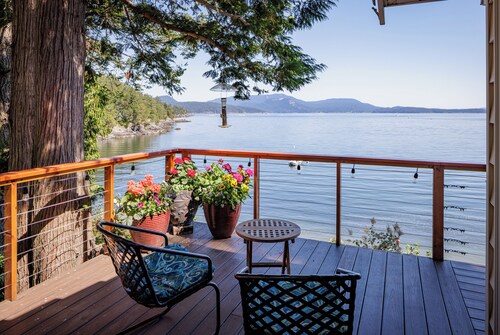 
Watch ferries come and go from this cozy waterfront home on Shoal Bay.