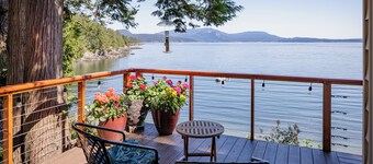 
Watch ferries come and go from this cozy waterfront home on Shoal Bay.