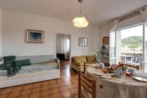 Apartment | Living area | 30-inch flat-screen TV with digital channels - Talamone Apartment View by Mamo Florence (Talamone)