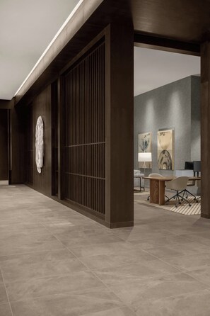 A modern interior with a wooden floor, a large sliding door, and a seating area with a table and chairs. - Ac Hotels By Marriott Boise Downtown (Boise)