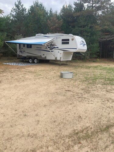27 foot fifth wheel on a small private campground.  Pets allowed.