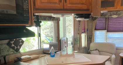 27 foot fifth wheel on a small private campground. Pets allowed.