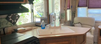 27 foot fifth wheel on a small private campground. Pets allowed.