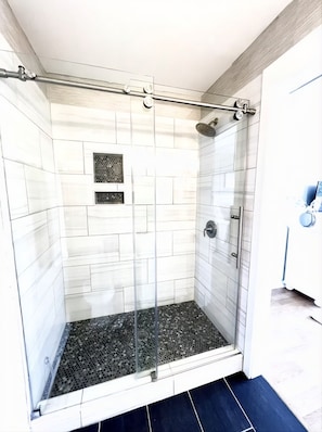 Shower, hair dryer, towels, soap