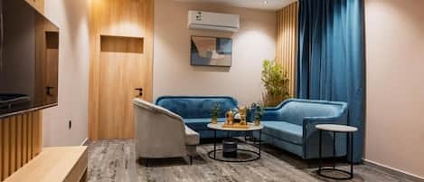 Suite Supérieure, balcon, vue ville | Coin séjour