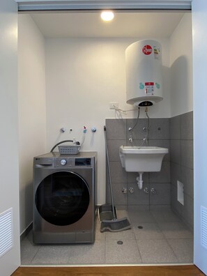 Apartamento superior | Lavanderia