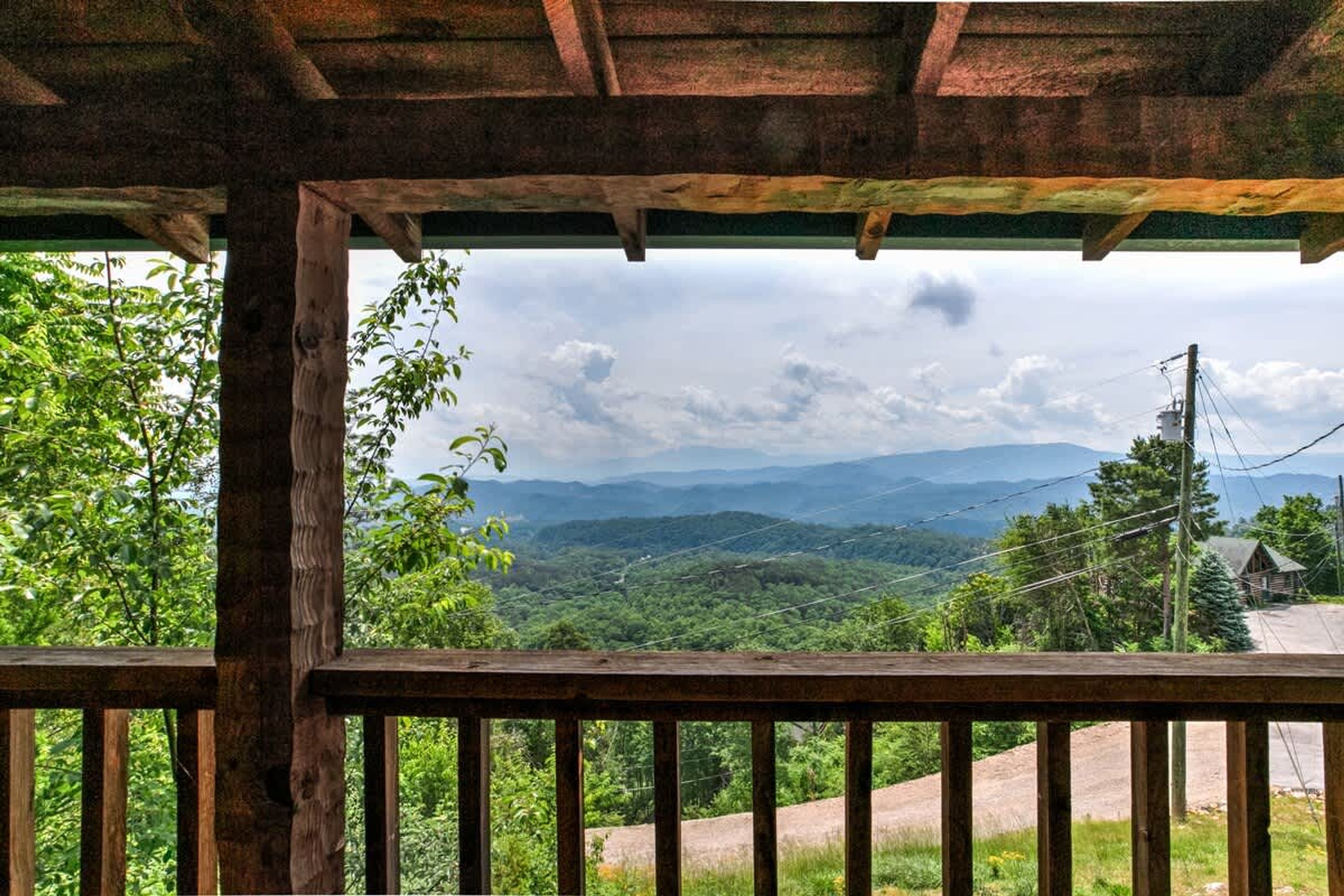 A wooden structure with a view of a mountainous landscape.