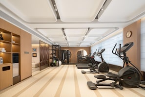 A modern gym with various exercise equipment, including treadmills and weight machines. - Hilton Garden Inn Dali Erhai Park (Dali)