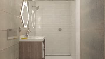 A modern bathroom with a toilet, sink, and shower.