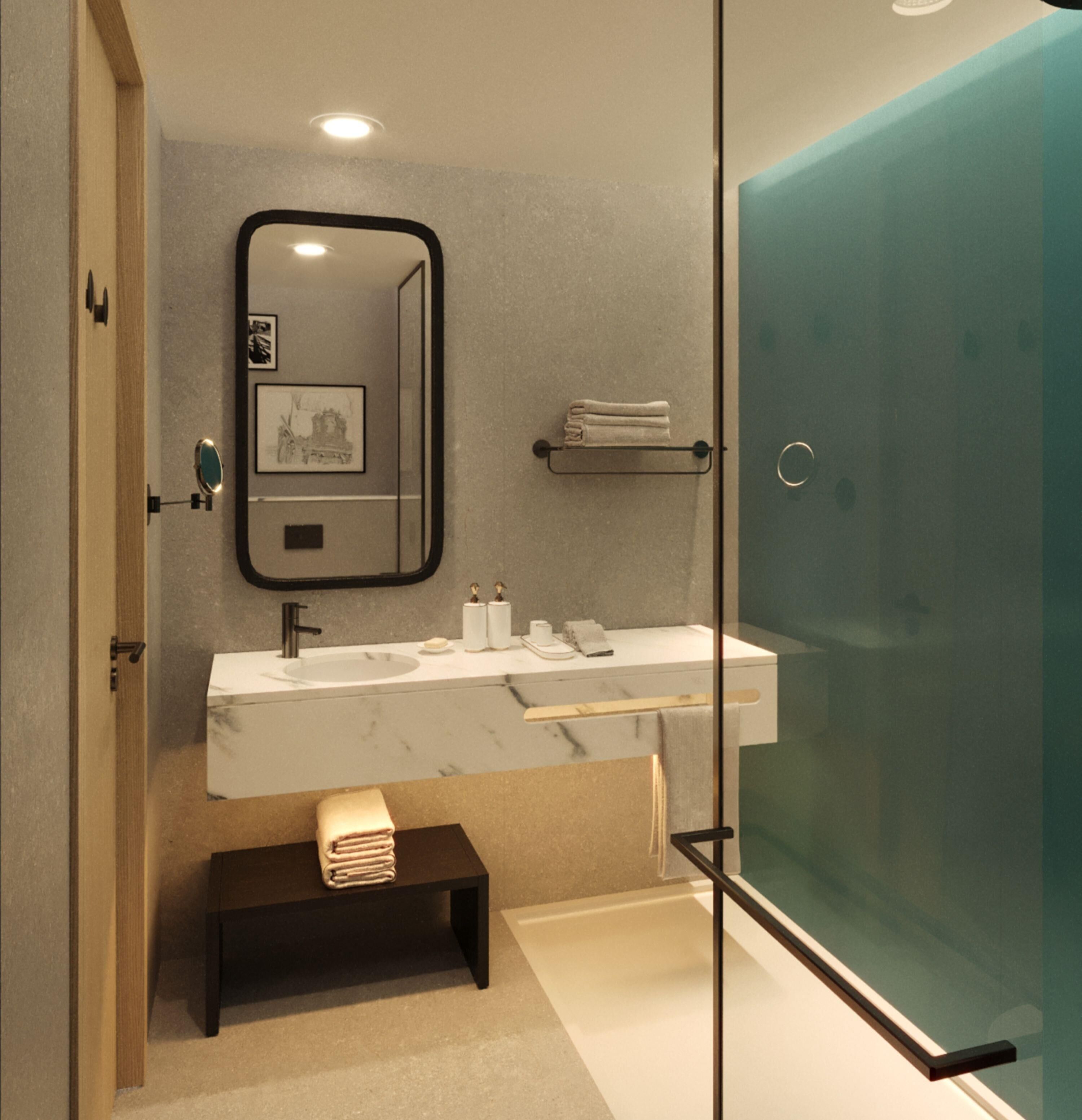 A modern bathroom with a glass shower enclosure, a marble sink, and a small bench with towels.