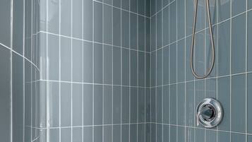 Shower, hair dryer, towels, shampoo