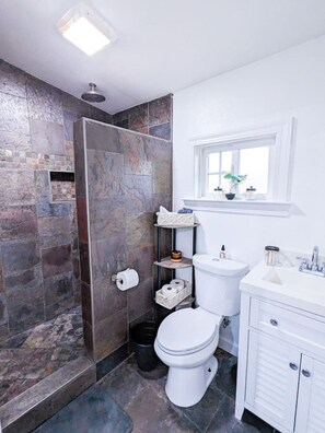 Shower, hair dryer, towels, soap