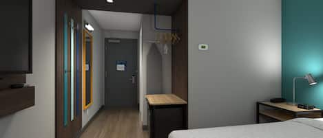 A hotel room with a bed, a desk, a TV, a mirror, and a wardrobe.