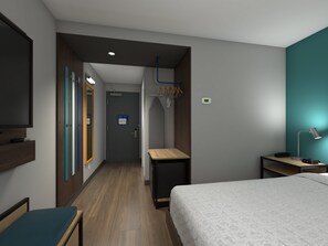 A hotel room with a bed, a desk, a TV, a mirror, and a wardrobe. - Tru by Hilton Austin University Capitol District (Austin)