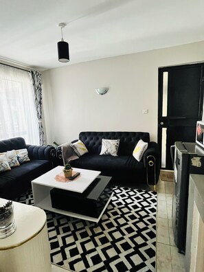 Living area - Cozy 1 bedroom Apartment - Royal Suburbs by Tsavo (Nairobi)