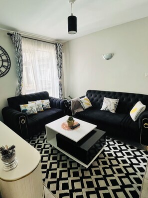 Living area - Cozy 1 bedroom Apartment - Royal Suburbs by Tsavo (Nairobi)