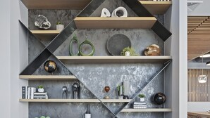 A modern interior with geometric shelving, decorative items, and a concrete wall. - Elysian Residences Boston (Boston)
