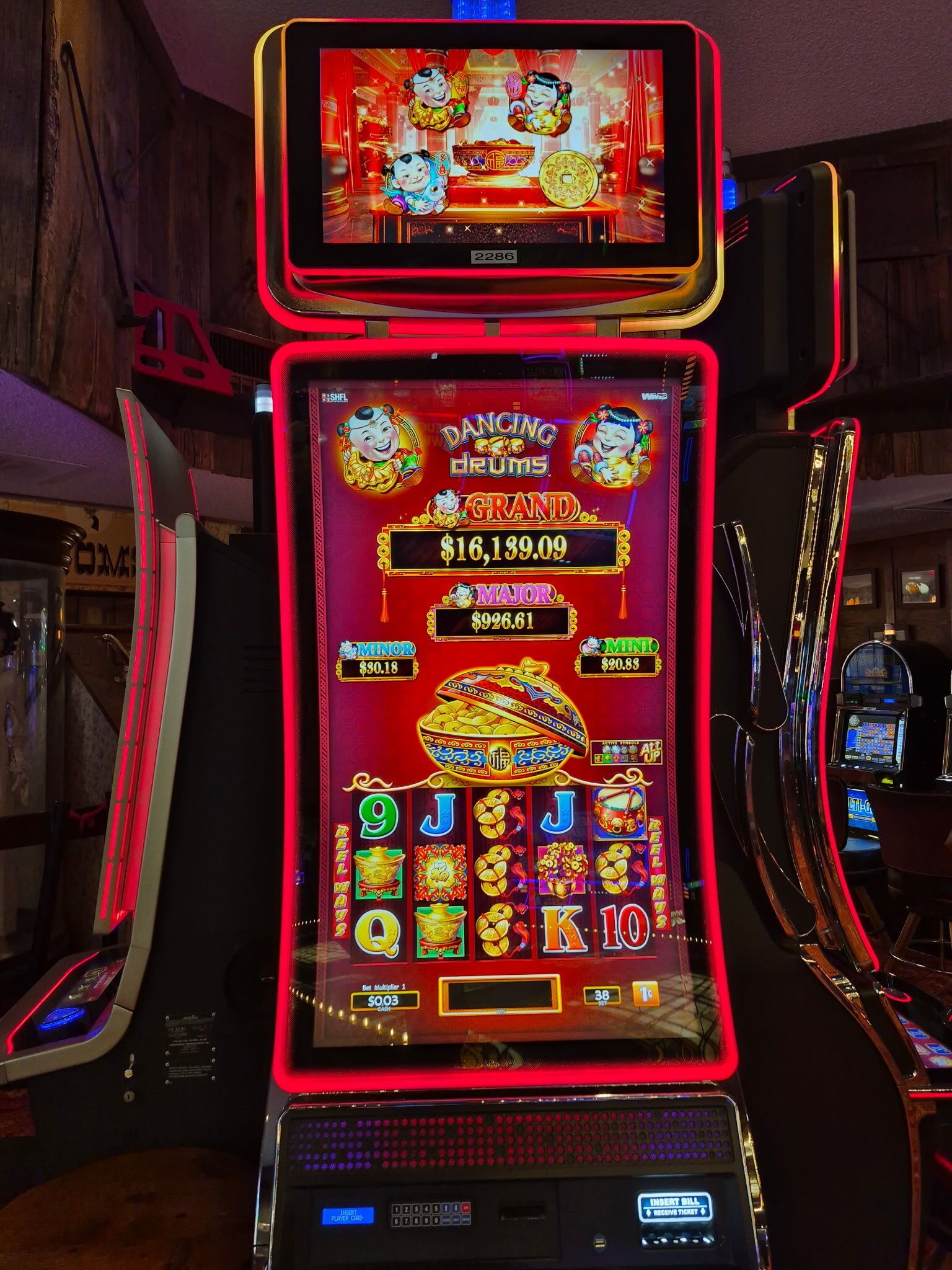 A slot machine with a large display and multiple reels.