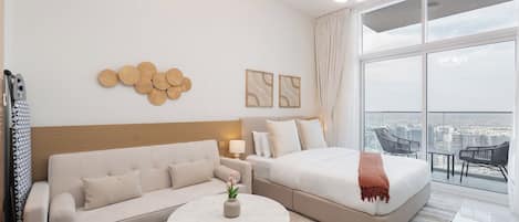 Luxury Studio, Balcony, City View | Living area | 65-inch Smart TV with cable channels, ping pong
