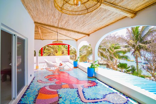 Villa Ipomée and its waterfront tropical garden on Ngor Island