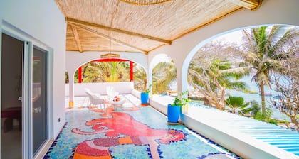 Villa Ipomée and its waterfront tropical garden on Ngor Island