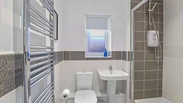 Shower, hair dryer, towels, shampoo