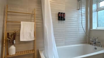 Shower, hair dryer, towels, shampoo